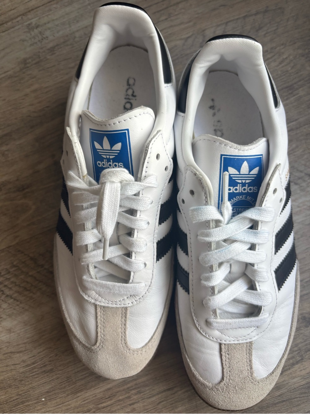 adidas White Sneakers with Black Stripes and Blue Tongue Logo